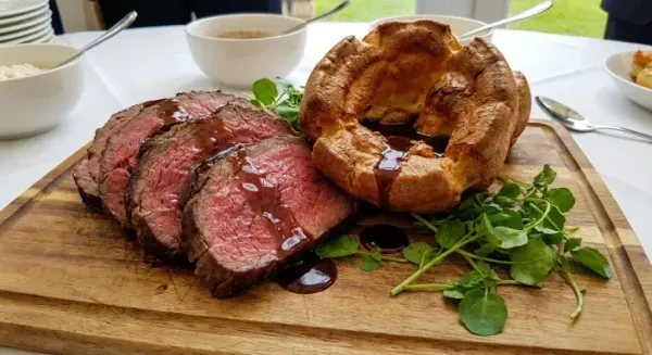 Rib of ruby red beef with watercress Yorkshire pudding and beef jus