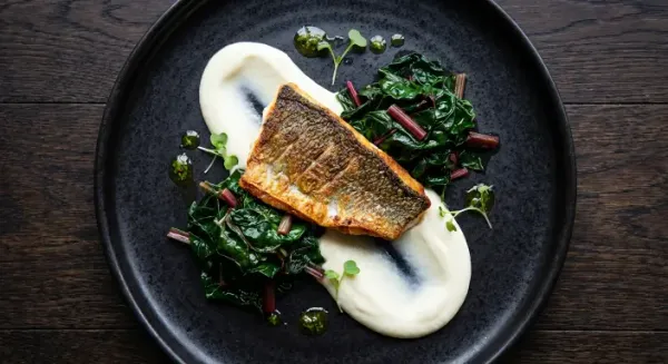 Sea bass with cauliflower and mustard garlic puree, Swiss chard